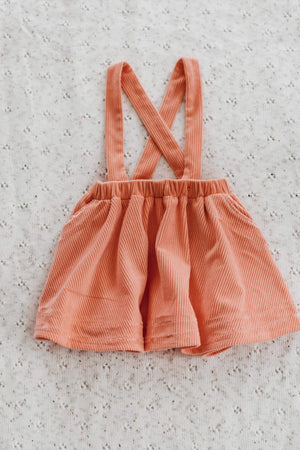 Orange skirt shop with suspenders