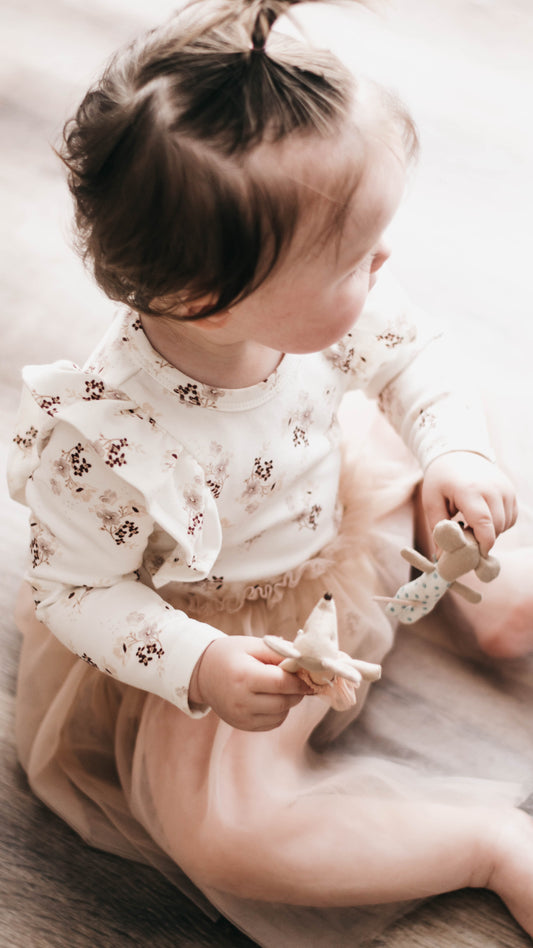 Photo of Toddler wearing Bencer and Hazelnut Tutu dress with frills on the sleeve